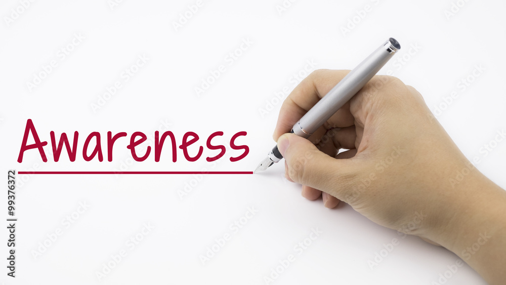 Woman Hand writing Awareness on white background. Woman Hand writing Awareness on white background.