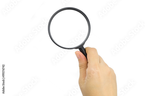 Woman hand holding magnifying glass on white background