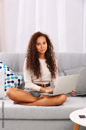 Young beautiful woman on so...