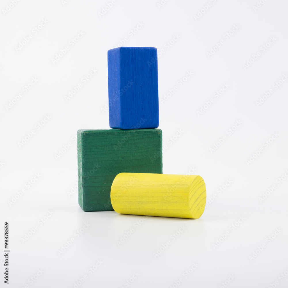 The wooden house. Children's toys - wooden cubes on a white background The wooden house. Children's toys - wooden cubes on a white background