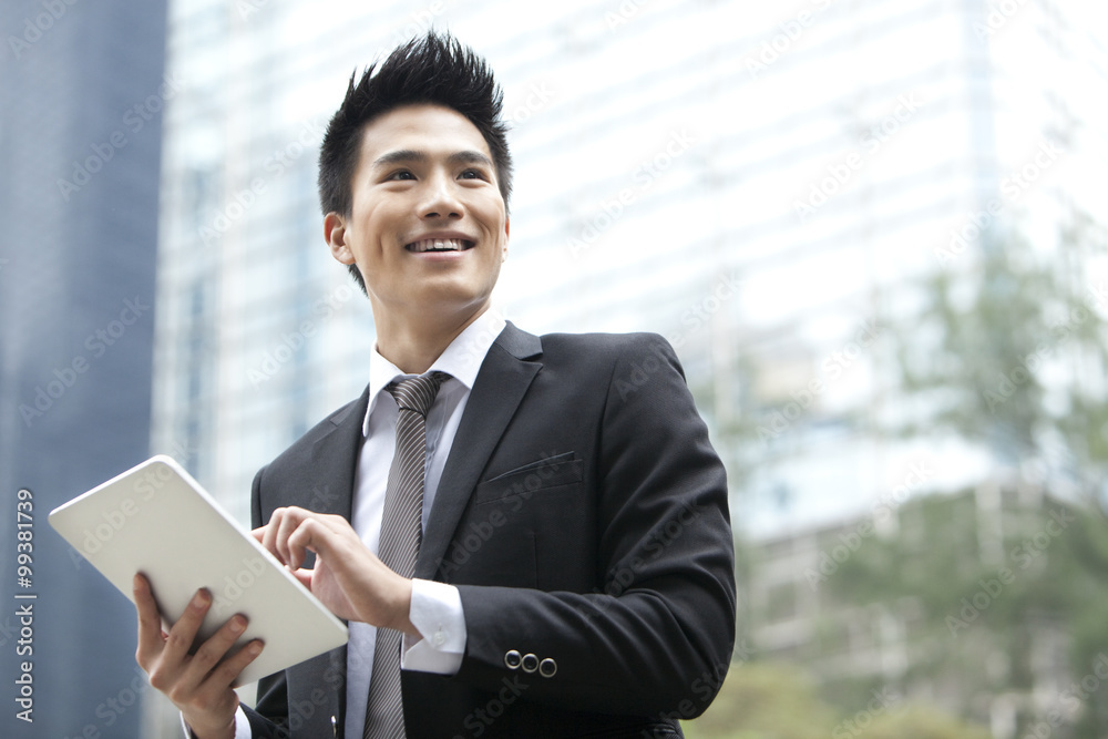 Professional businessman with digital tablet, Hong Kong Professional businessman with digital tablet, Hong Kong