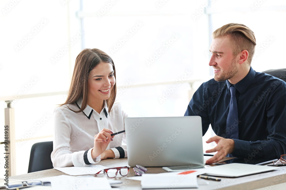 Businessman and businesswoman working in office Businessman and businesswoman working in office
