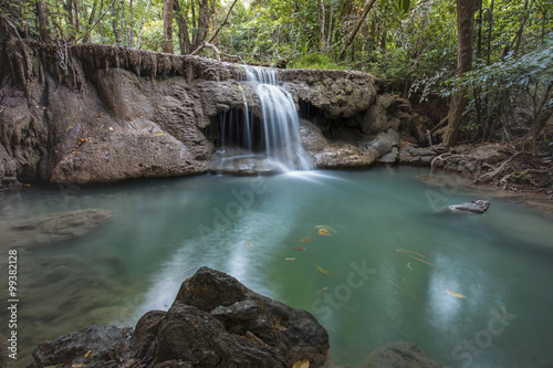 tropical waterfall in deep forest of Kanchanaburi province, Thailand.