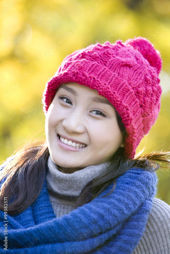 Young Woman in a Park in Autumn Young Woman in a Park in Autumn