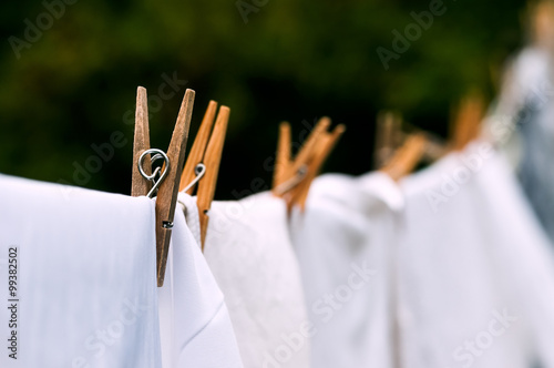 Eco-friendly washing line white laundry drying outdoors