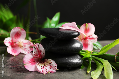 Beautiful spa composition with roses  bamboo and stones