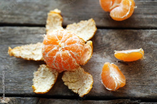 Tangerines on old wooden table, close up