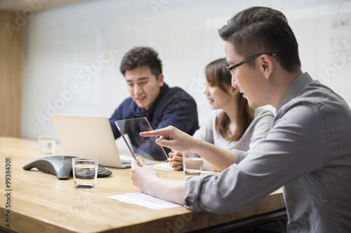 IT workers developing digital tablet