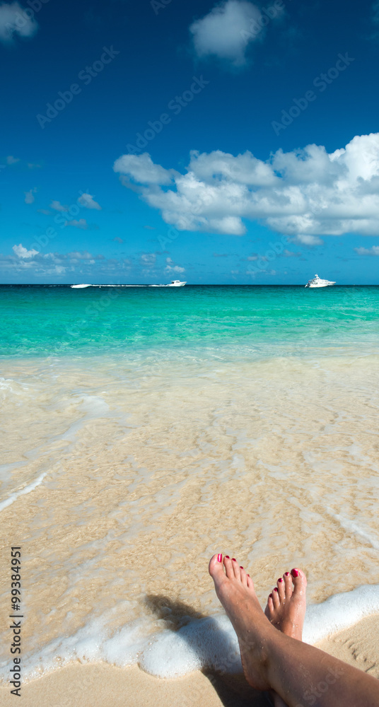 Woman's feet in a Caribbean Beach Woman's feet in a Caribbean Beach