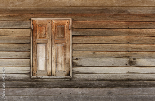 Old wooden window on wooden wall
