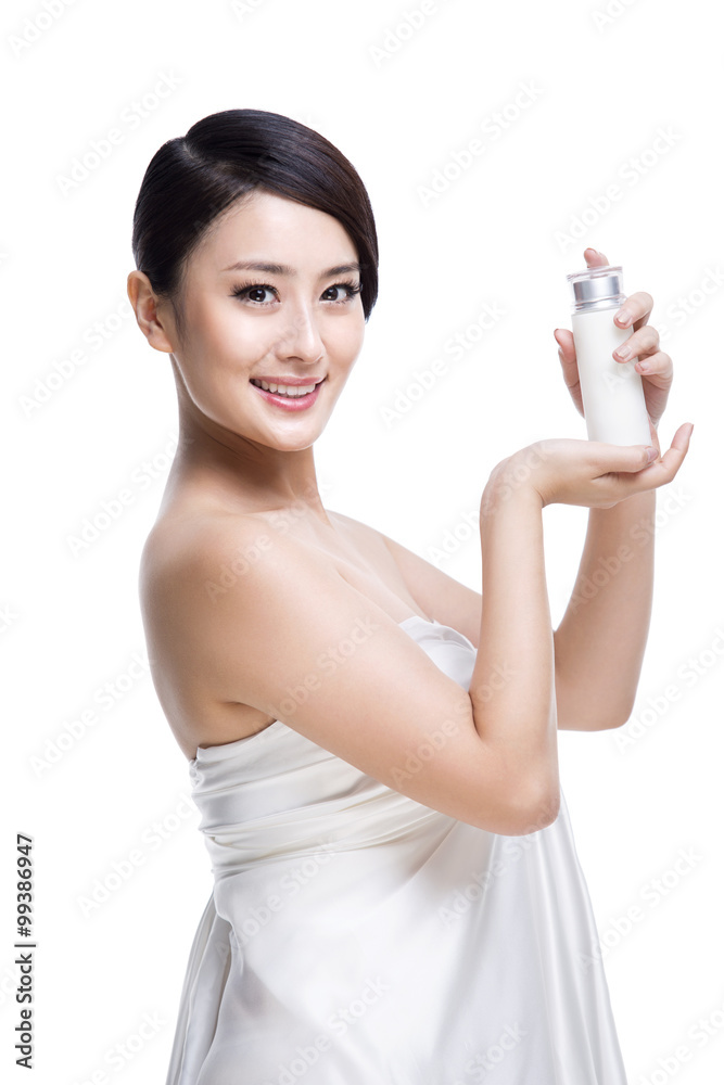 Beautiful young woman with lotion Beautiful young woman with lotion
