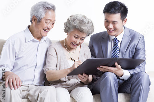 Senior couple with financial advisor