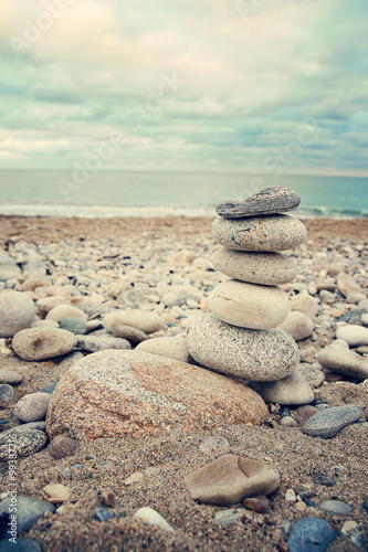 Stacked stones on the beach. Summer, vacation, travel, spa, relaxation, nautical and life style concept