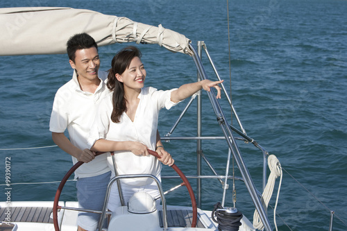 Young couple sailing © Blue Jean Images