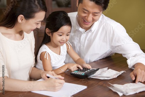 Family calculating bills together