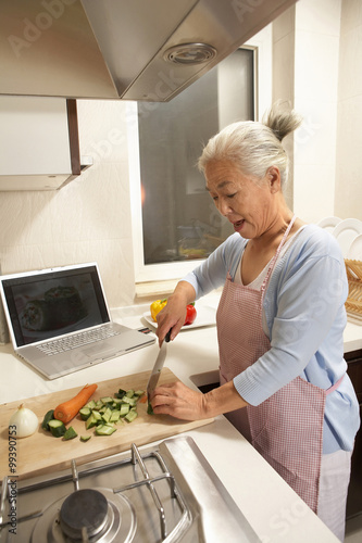 Elderly Woman In The Kitchen
