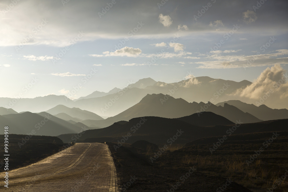 Road and mountain range in Gansu province, China