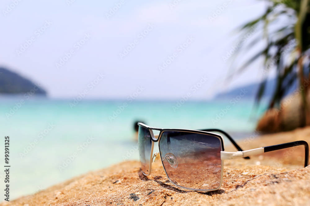 sunglasses on the stone with see sunglasses on the stone with see