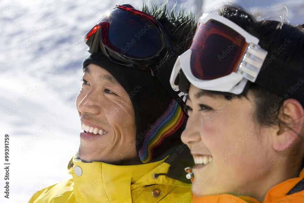 Close-up of a young man and young woman smiling Close-up of a young man and young woman smiling