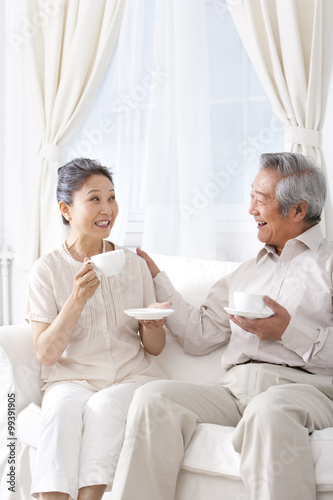 Happy couple enjoying tea