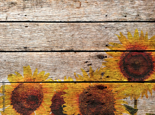 sunflowers paint on old panel wooden background photo