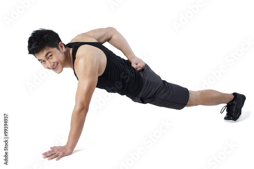 Man doing one-handed push-ups © Blue Jean Images
