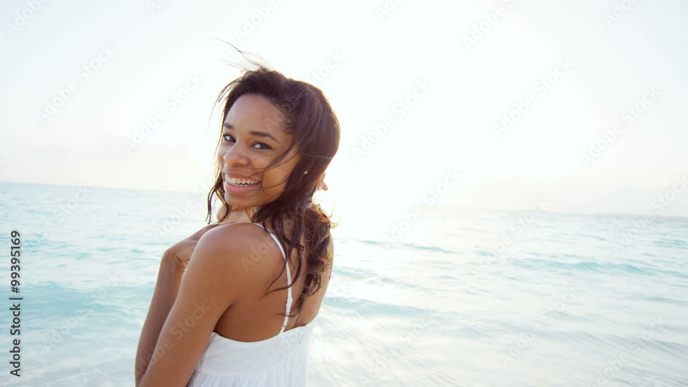 Portrait of ethnic African American female on ocean beach Portrait of ethnic African American female on ocean beach
