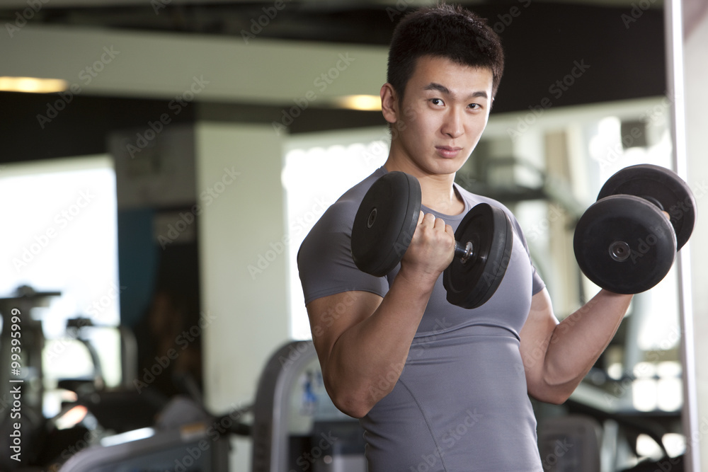 Young Man Holding Weights Young Man Holding Weights