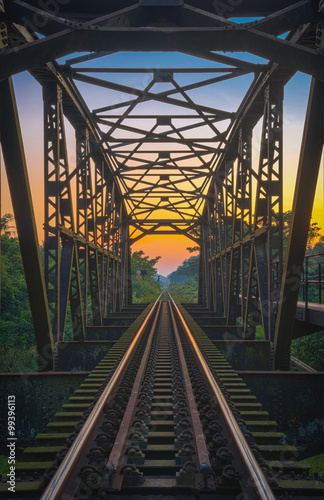 Fototapeta Naklejka Na Ścianę i Meble -  Sunset at the railway bridge in rural of Thailand.