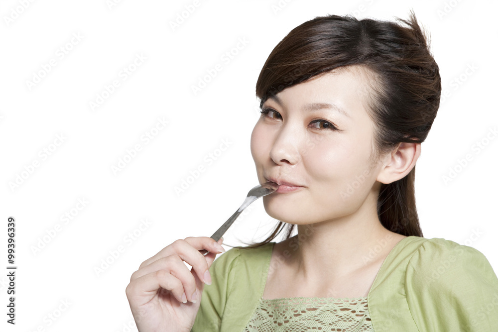 Portrait of Young Woman Eating From Spoon Portrait of Young Woman Eating From Spoon