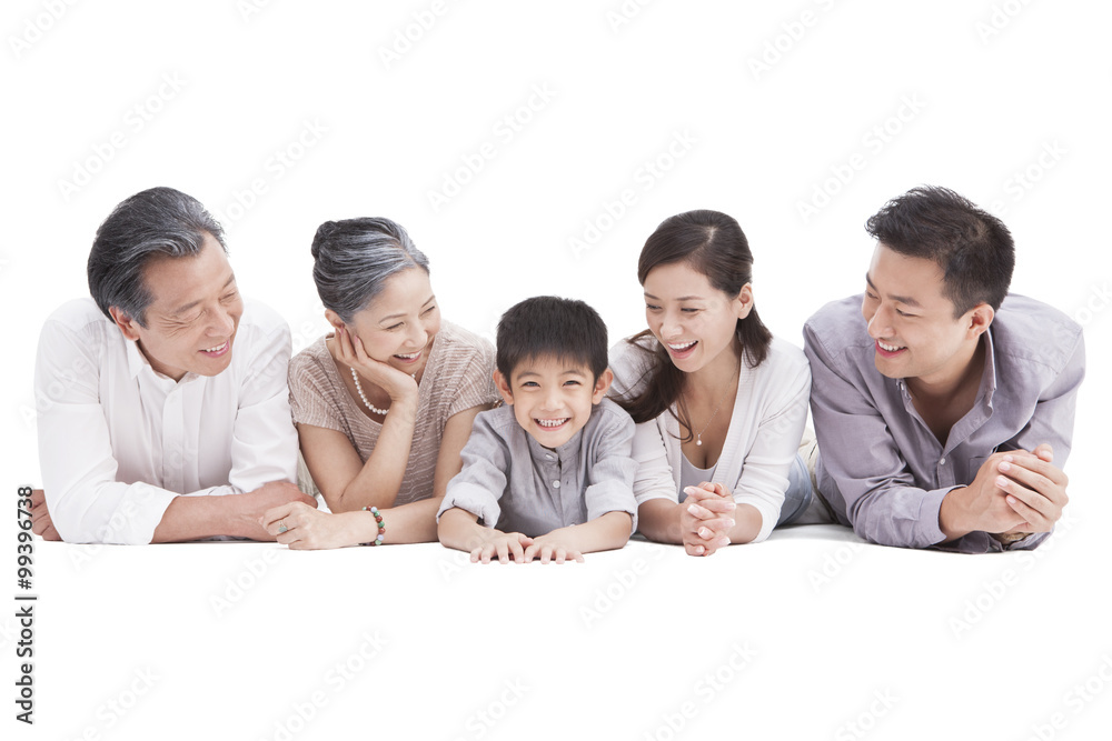 Happy three generation family lying down on ground Happy three generation family lying down on ground