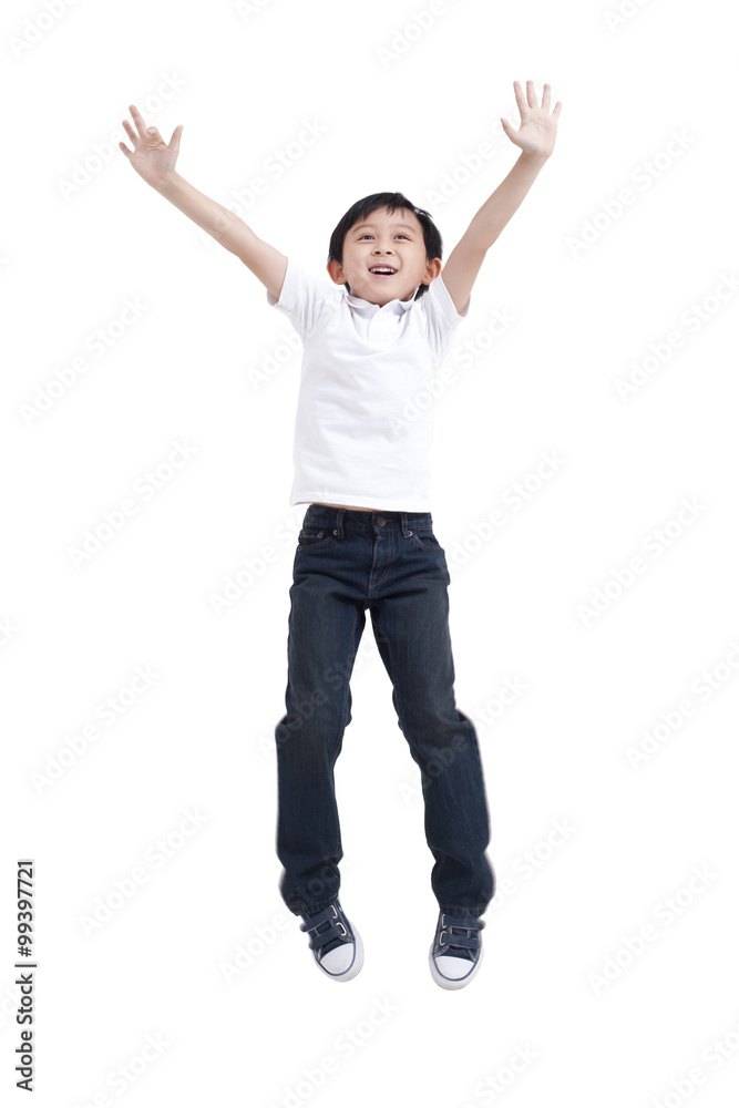 Young boy jumping in mid-air Young boy jumping in mid-air