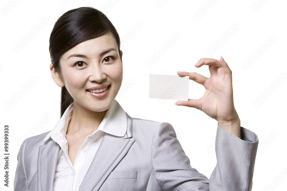 Businesswoman holding a card Businesswoman holding a card