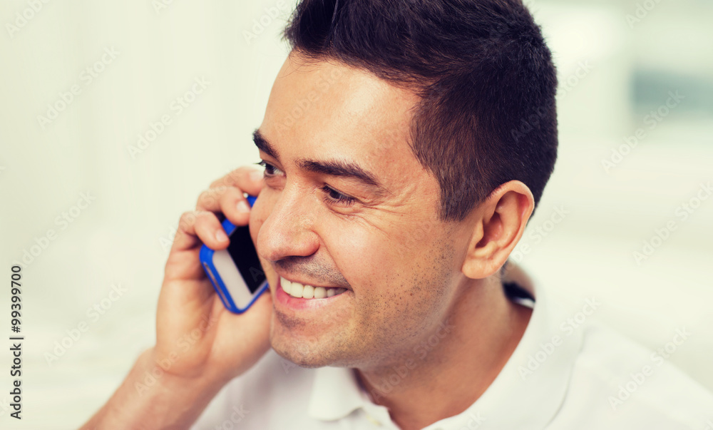 happy man calling on smartphone at home happy man calling on smartphone at home