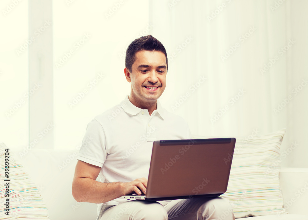 happy man working with laptop computer at home happy man working with laptop computer at home