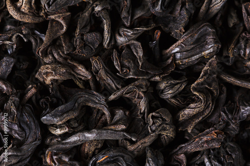 Black tea dry leaves. Macro, background