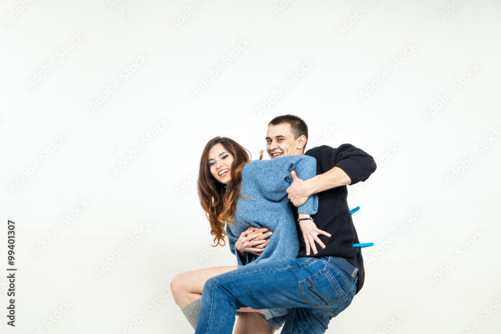 Portrait of happy couple isolated on white background. Attractive man and woman being playful. Portrait of happy couple isolated on white background. Attractive man and woman being playful.