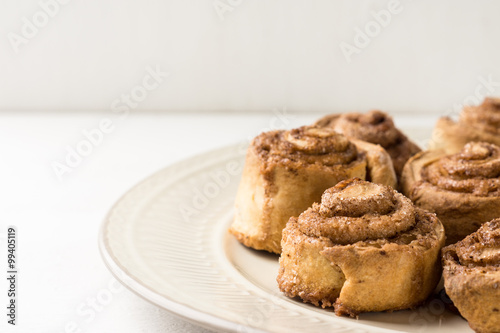Cinnamon rolls on the wooden background