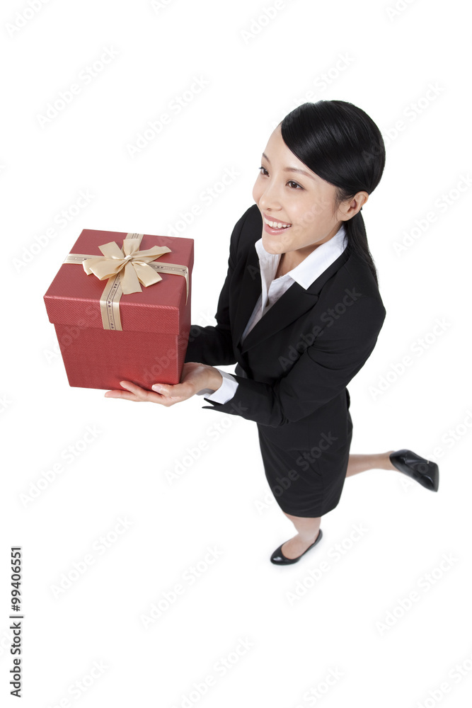 Happy Businesswoman Holding a Gift Happy Businesswoman Holding a Gift