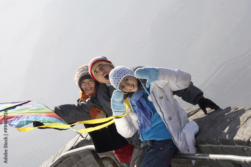 Young People Flying A Kite On The Great Wall Of China Young People Flying A Kite On The Great Wall Of China