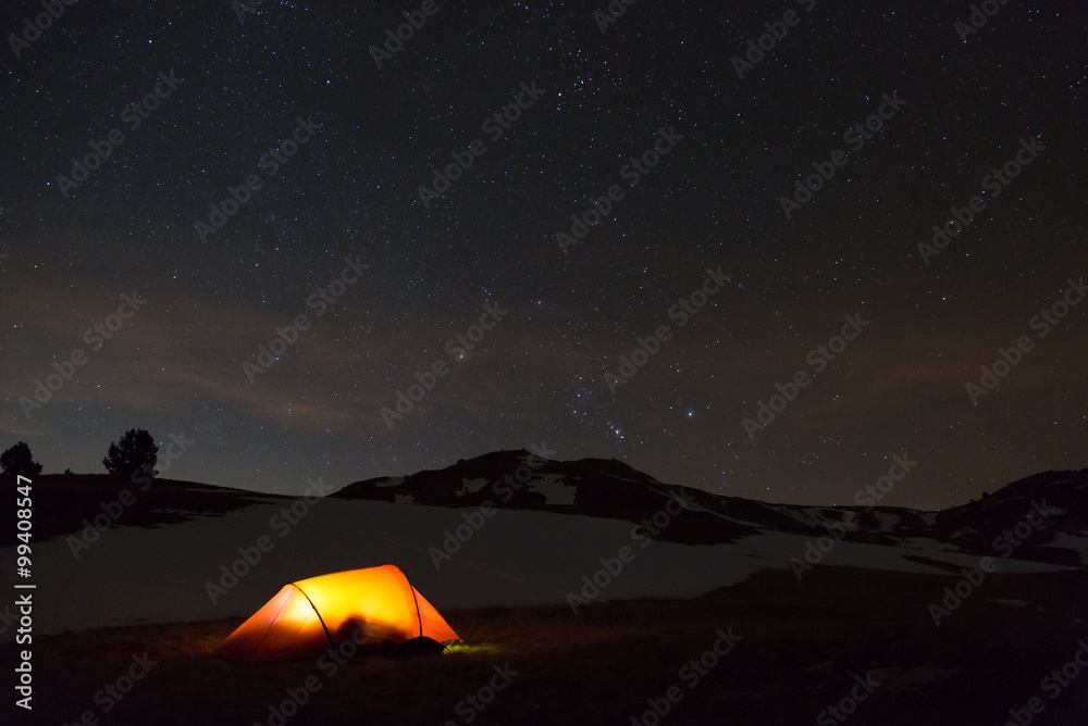 Red tent under the stars on a campsite in the French Vercors.