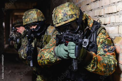 Team of Special Forces from Germany with weapon/Group of elite police marksmen with weapon in building during a special operation