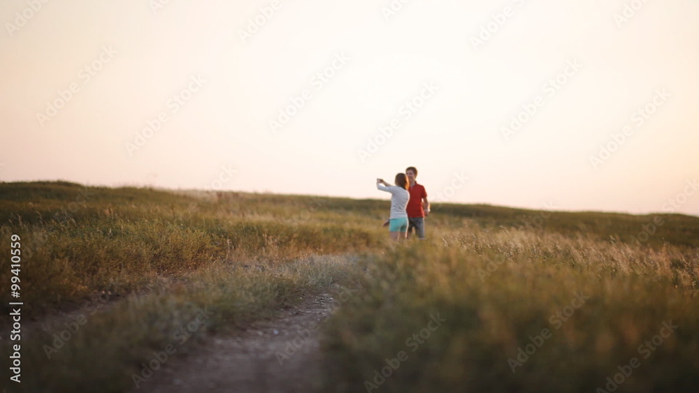 young couple in love in the mountains went off holding each other's hands young couple in love in the mountains went off holding each other's hands