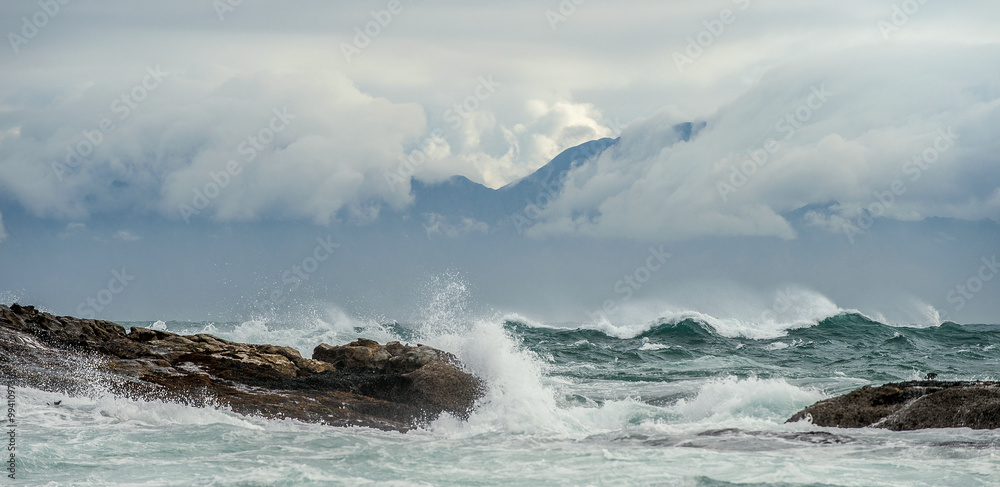 Sea landscape. An morning, Clouds sky and mountains.
