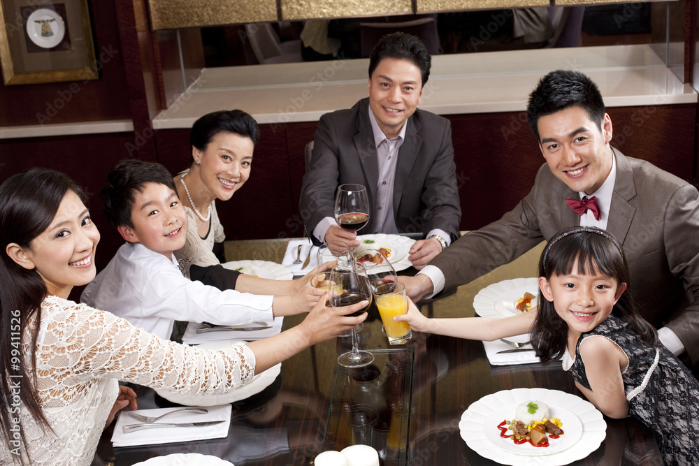 Family having dinner in a luxurious dinning room Family having dinner in a luxurious dinning room