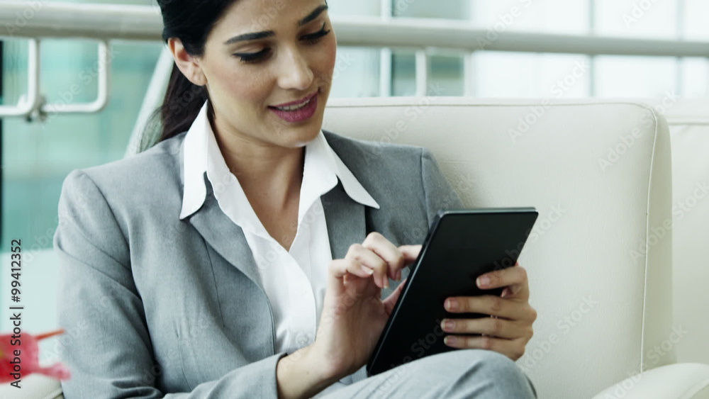 brunette Hispanic business female hotel travel cloud technology tablet device brunette Hispanic business female hotel travel cloud technology tablet device