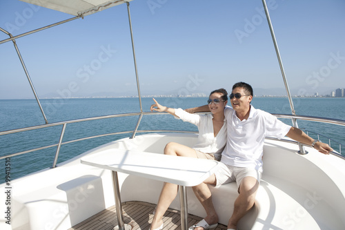 Happy Couple Relaxing on a Yacht