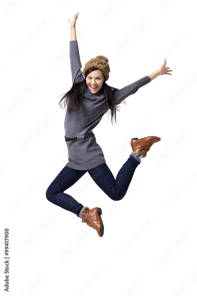 Young woman jumping in mid-air