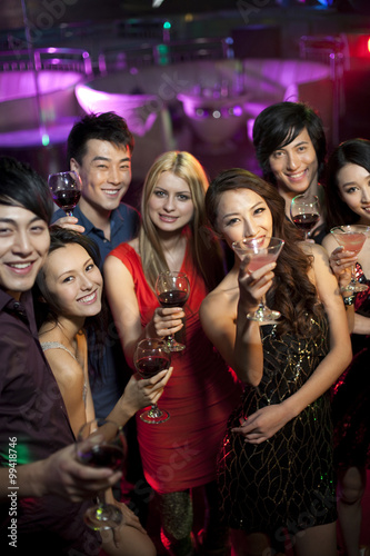 Stylish young people drinking in bar