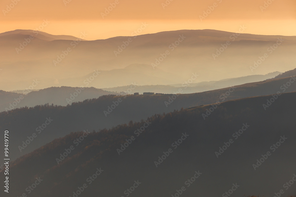 Sunset in the mountains in orange tones